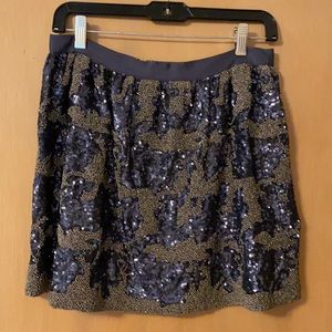 Sequined mini skirt uniquely patterned. Dusty blue